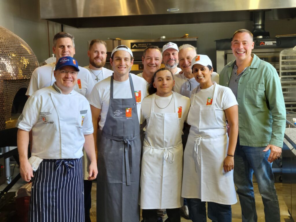 Students practicing professional pizza making at the North American Pizza & Culinary Academy